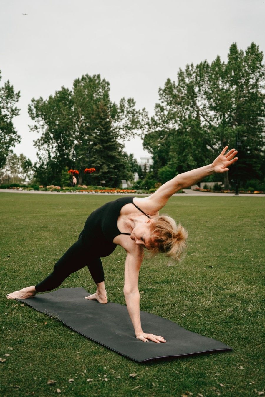 woman-stretching-body-on-yoga-mat