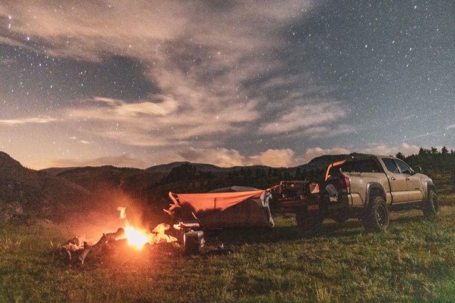 brown-pickup-truck-beside-brown-camping-tent